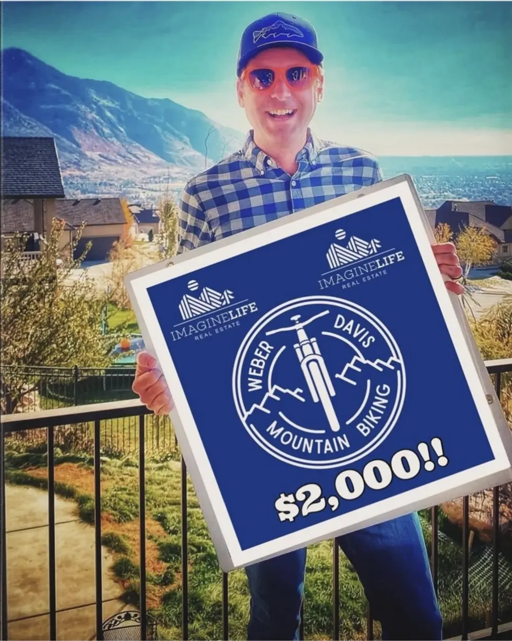 David Owen presenting a two-thousand-dollar donation to local mountain biking